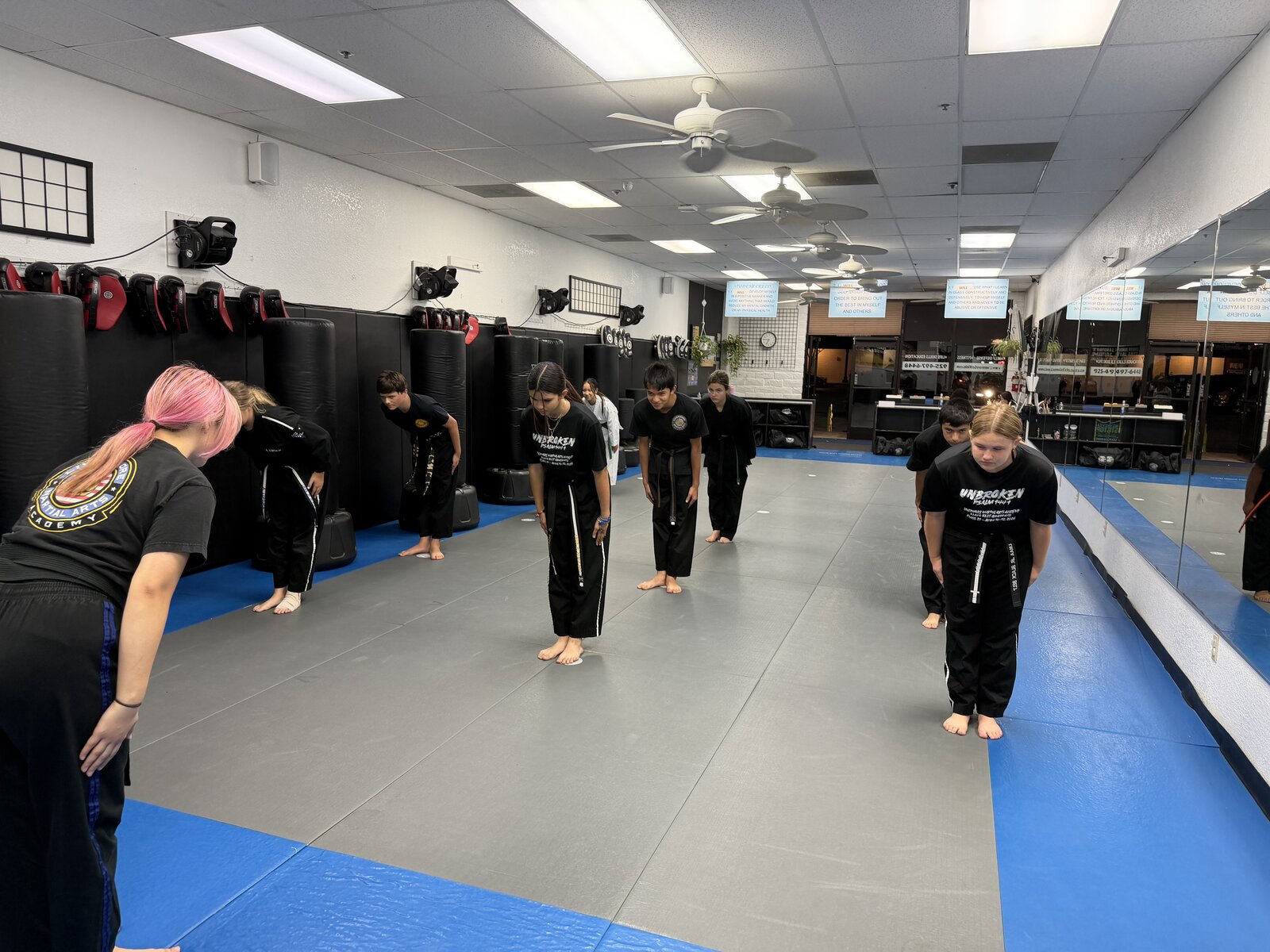 Junior Warriors students bowing together at the start of class