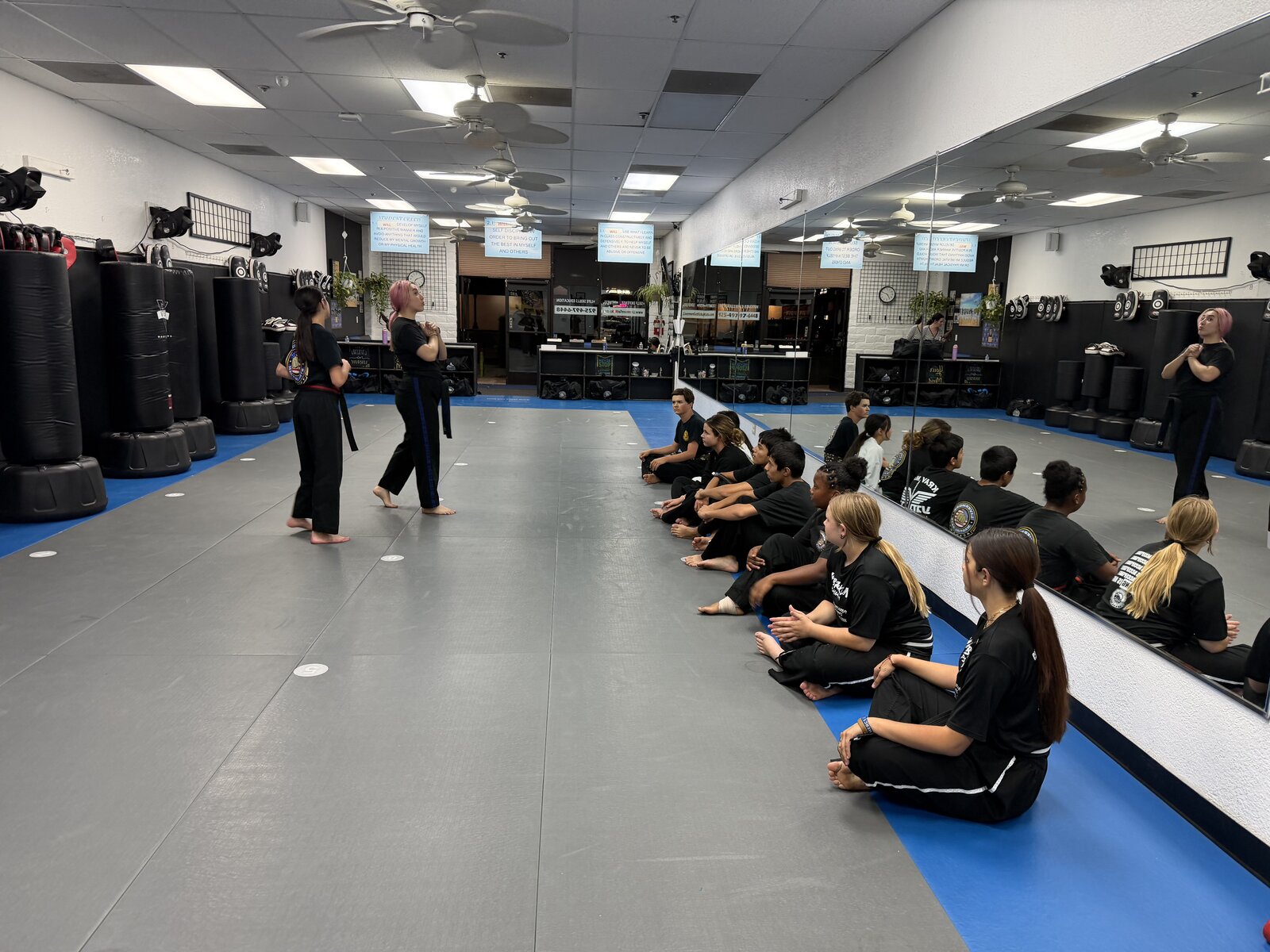 Junior Warriors students listening to their instructor during class